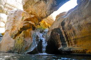 Waterfalls inside the cave pool of Wadi Shab